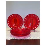 Set of (4) ruby red pressed glass plates featuring a scalloped rim and open-work pierced border design - 7-1/2”
