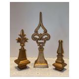Grouping of (3) gold-tone cast iron finial home decor pieces - 6”, 12” and 8-1/4” tall