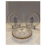 Set of (4) open-work glass sandwich plate with a gold-trimmed scalloped rim and a frosted pierced or lattice-style pattern around the border - 8”