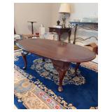 Queen Anne style cherry finish oval coffee table - 46 x 28 x 17 tall