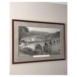 “The Tour of the 20s - Racing over the Bridge”  - framed black-and-white print depicts the historic Dinan Viaduct (Le Viaduc de Dinan / Pont de Dinan) in Brittany, France, scene from the Tour de F