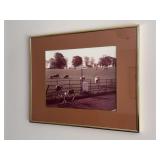 Sepia-toned framed photographic print depicting a rural pasture scene with a "Lancashire" road sign and bicycles in the foreground - 20-1/2 x 16-1/2