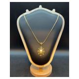 Vintage 1928 Brand long necklace withoval medallion with intricate openwork scrollwork or filigree metal framing
