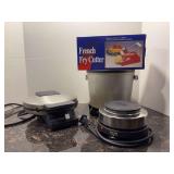 Grouping of kitchen gadgets and small appliances - Cuisinart waffle maker, Fry Daddy deep fryer, French Fry Cutter and Small Hot Plate