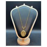 Vintage 1928 Brand long necklace withoval medallion with intricate detailing