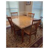 Beautiful Haverty’s Furniture traditional granite-top dining table with a wooden base, turned legs and matching spindle-back chairs