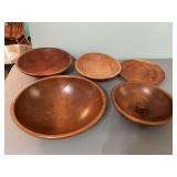 Assortment of five wooden pieces varying from 12 inches to 15 inches