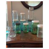 Assortment of canning jars, mostly blue and green ball, several wide mouth.