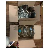 Two boxes of kitchenware and lids