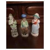 Three Dutch boys and girls porcelain figurines. Japan -3 inches tall.
