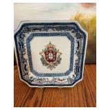 Vintage Square 7 3/4” porcelain decorative plate featuring an oriental blue and white floral border and a multicolored Heraldic C￼rest.
