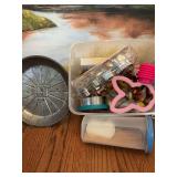 LJH vintage 8 1/2 inch metal pie 10” with perforations. Lloyd J Harris.  A Tupperware 6 1/2 inch spaghetti canister and a tub full of cake and cookie decorating items.