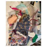 12 McCall’s doll clothes patterns plus material and patterns of started doll clothes and scraps