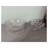 12 inch scalloped edge circle and star pattern Punchbowl with 13 inch under plate. And a 9 x 6” pedestal fruit bowl.