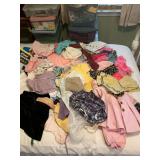 Large assortment of doll clothes