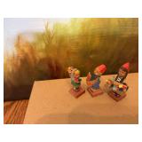 Vintage Erzgebirge carved wood girls with flowers and boy miniature figurines. Germany.