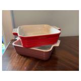 5” x 5”Le Creuset premium stoneware baking dishes in red and purple.