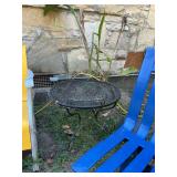 Black wrought iron 24” round table with a mesh top. 18” tall