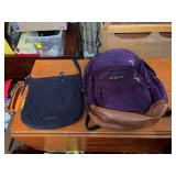 Purple Jansport backpack and a navy blue Vera Bradley purse