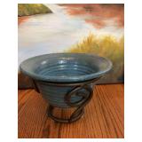 9“ x 4 1/2“ Blue pottery bowl signed T. Baucom in a heavy metal base.