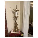 21 inch brass lamp with no shade or finial, and two books