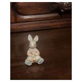 Miniature porcelain one and three-quarter inch rabbit.