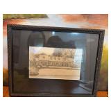 Black framed illustration of a house by Lisa James. 14” x 11”