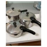 Three presto stainless steel pressure cookers