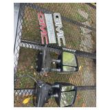 GMC truck parts. Two mirrors for a Nissan Titan and three GMC emblems.