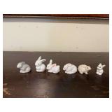 Assortment of porcelain and plastic bunny rabbits. Tallest is 1“