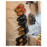 Four pair of size 38 Birkenstocks and a 8 1/2 new balance tennis shoe