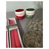 Three flower frogs 1 -5 inch and 2- 3 inch, four red 10 inch tapers and a set of 2 1/2 inch mini bowls
