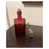Amber miniature, vintage cabin, whiskey bottle and a wooden miniature pelican