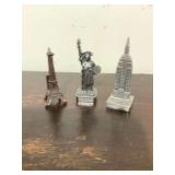 Eiffel Tower miniature, Statue of Liberty pewter, and pewter Empire State building
