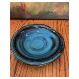 Studio pottery plate, signed, in blues and black. 7”