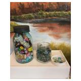 A jar of miniature doll foods, and a jar of decorative stones