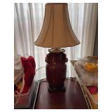 Bradburn Gallery, vintage red Sang de Boeuf table lamp with pomegranate details, a wood base and brass top. 29 inches.