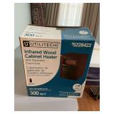 Infrared wood cabinet heater new inbox. Covers 300 ft.² by Utilitech