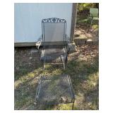 Wrought iron chair and foot rest set.