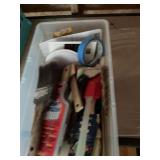 Container full of paint and supplies