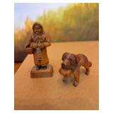 Vintage hand carved figurine of a woman with basket and a hand carved Saint Bernard dog