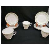 Three Shamrock bread (tea cake, snack, dessert) plates, footed cups, and saucers made by Royal Tara in Ireland.