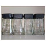 8 hourglass shaped storage jars. 7 in tall