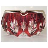 Beautiful and heavy Artist signed ruby red cut-to-clear crystal ashtray made by Val Saint Lambert in Belgium during the 1960s. 4.25 diameter x 2.5 in tall.
