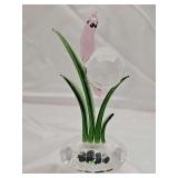 Pink crystal snail with a faceted crystal shell, nestled among green glass leaves on a clear crystal base. 5 in tall.