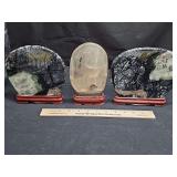 Three Asian mineral stone sculptures.