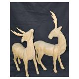 Two hand-carved (in the Philippines) wooden antelope sculptures. 11 and 15 in tall including antlers.