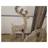 Two electric lighted deer. 24 and 49 in tall.