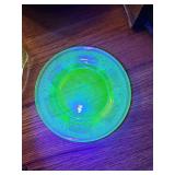 Two uranium glass plates, 1930s Federal Glass lovebirds pattern. 8.5 in diameter. One appears to have dishwasher coating on it. Easels not included.