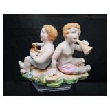 Hal-Sey Fifth Ave bisque porcelain cherubs (putti)  figurine. 5.75 x 2.5 x 3.75 in tall.